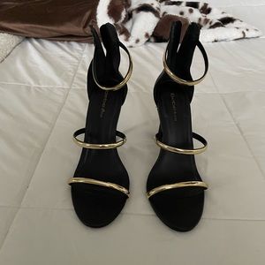 Bebe Black and Gold Strappy Heels